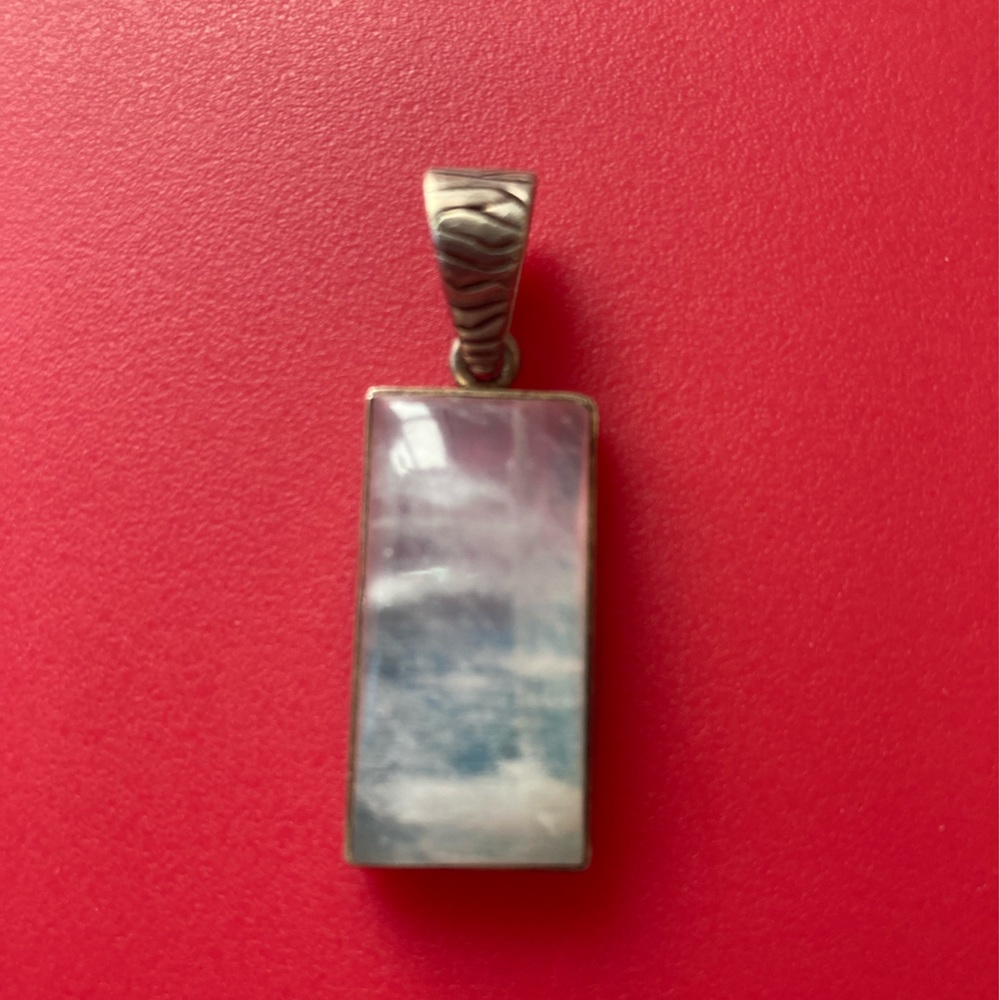 Silver pendant with pink and blue stone